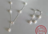 Sterling Silver Necklace. Delicate chain with pearls stationed along the front.